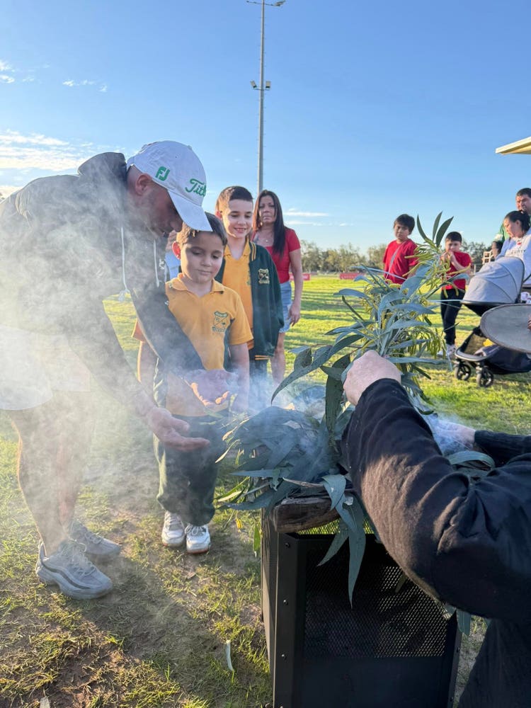 May be an image of 9 people and grass