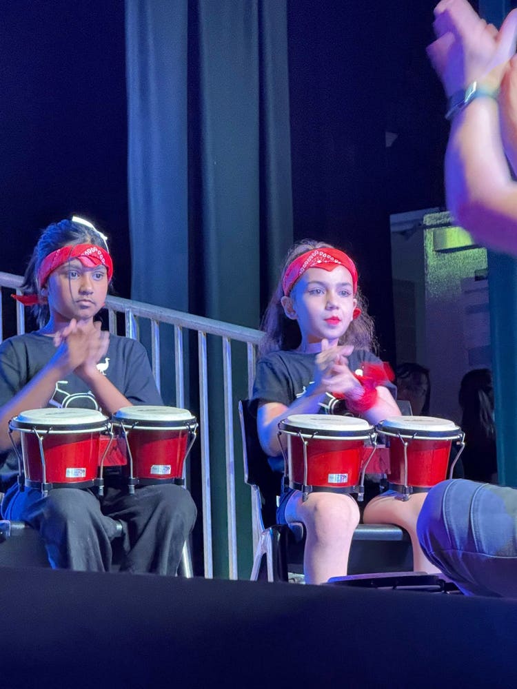 May be an image of 3 people and musical instrument