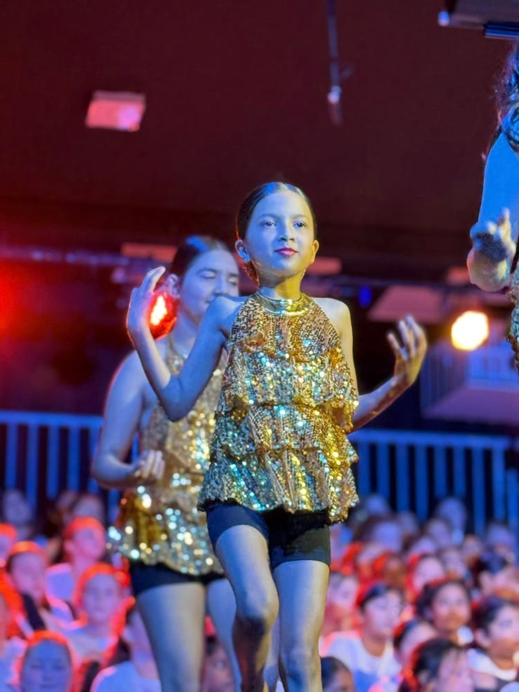 May be an image of 2 people, child and people dancing